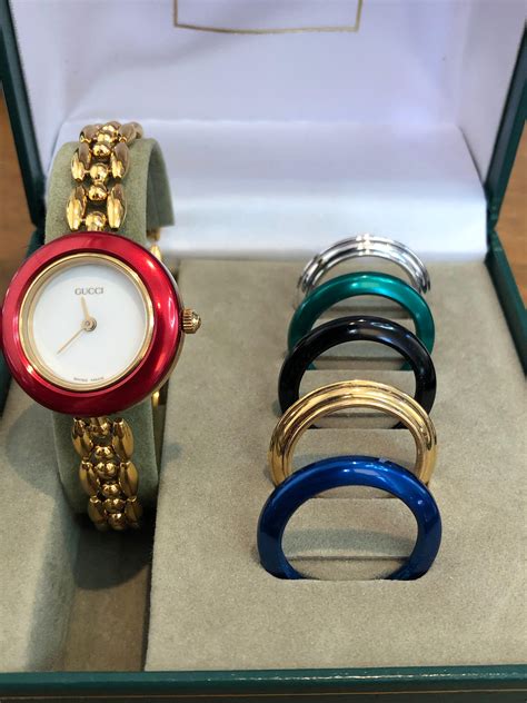 gucci interchangeable ring watch|Gucci watch with changeable bezels.